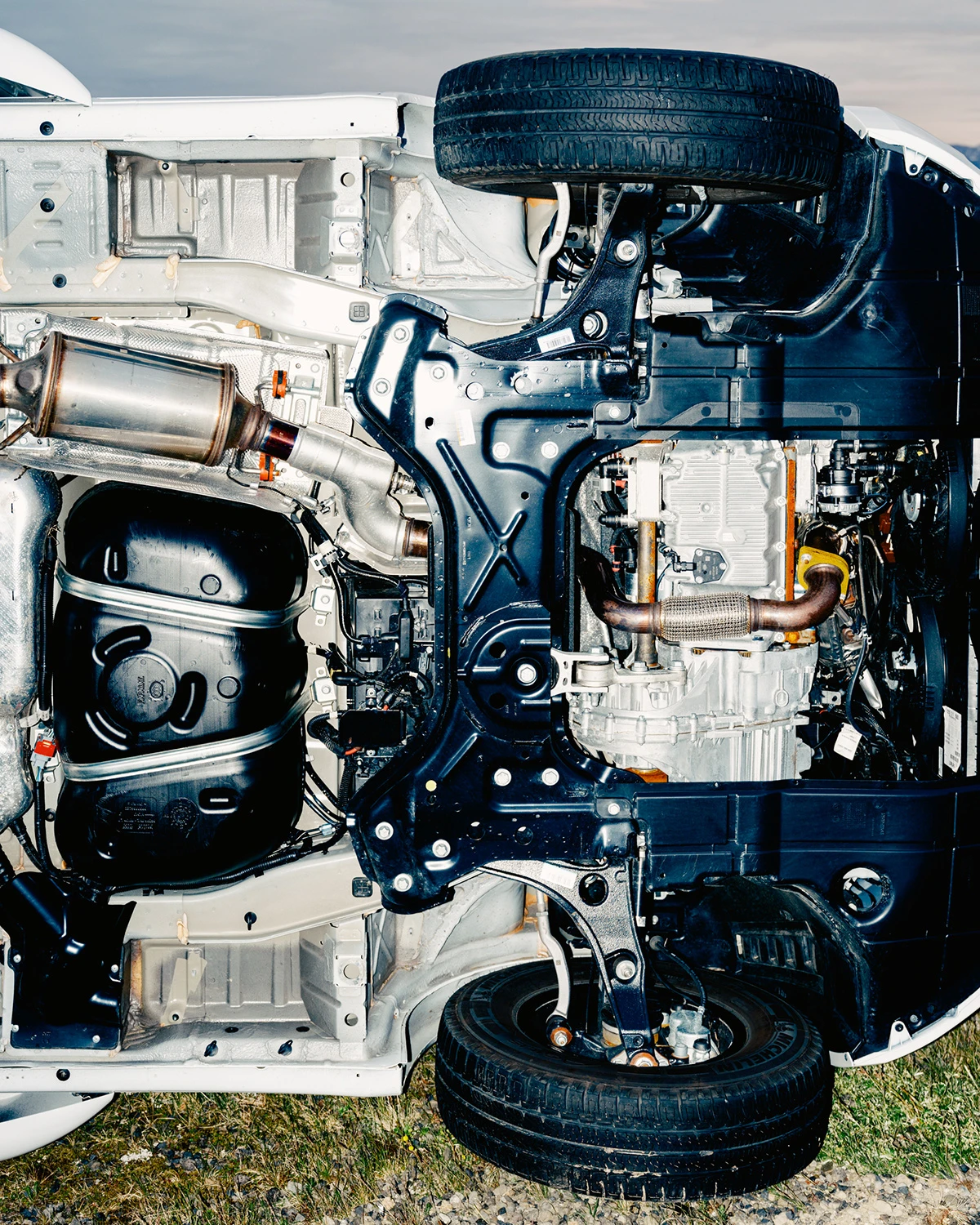 Lupine by Daniel Dorsa — Overhead view of a vehicle's undercarriage and engine bay, dissected to reveal structural and mechanical systems.
