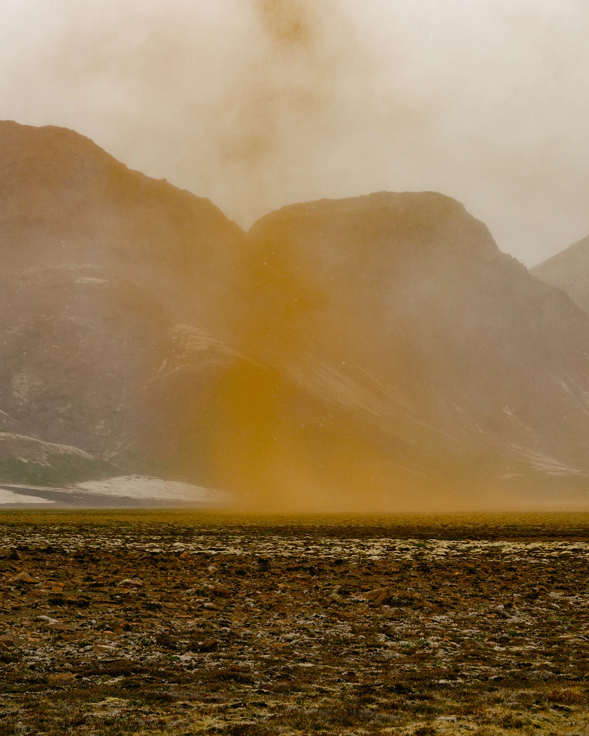 Lupine by Daniel Dorsa — A towering column of ochre-toned dust and volcanic ash rises from barren terrain, its billowing form occupying the center of the composition.