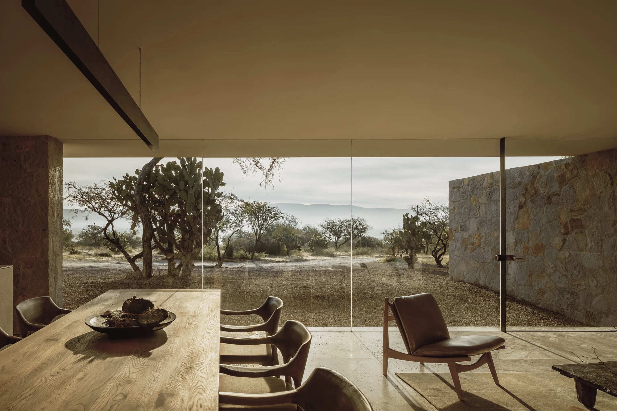 Enso House II by HW Studio — Floor-to-ceiling glazing frames the mesquite-dotted landscape in this interior view of Enso House II.
