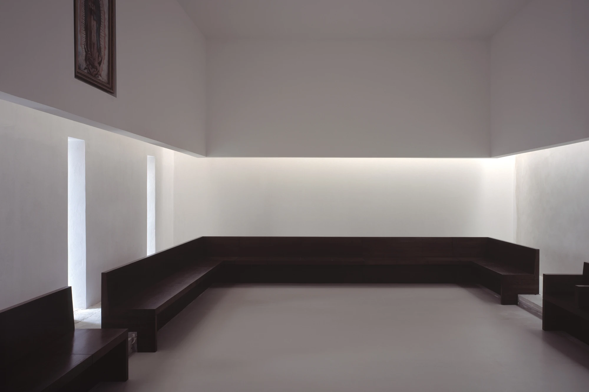 Abbey of Our Lady of Nový Dvůr by John Pawson — The chapel interior at Abbey of Our Lady of Nový Dvůr demonstrates Pawson's reduction of Cistercian spatial requirements to essential elements.
