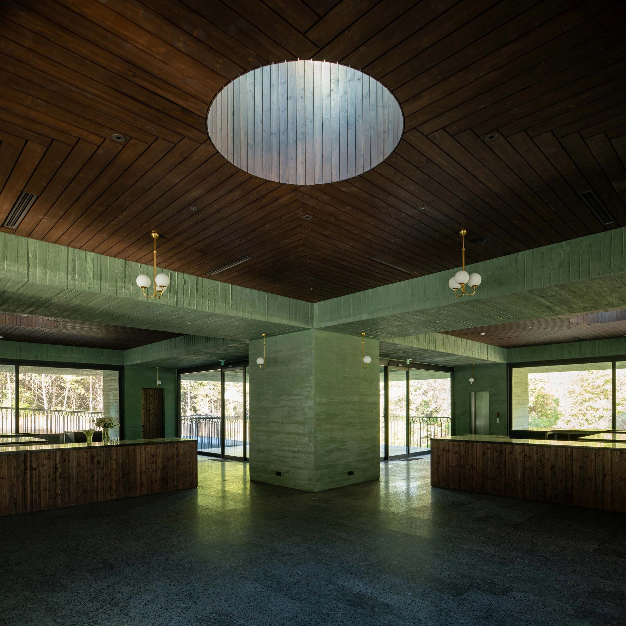 REST Garden Restaurant by Pezo von Ellrichshausen — The interior of REST Garden Restaurant unfolds as a columnar forest, nine concrete shafts arranged in rigid grid formation rising toward a wood-slat ceiling.