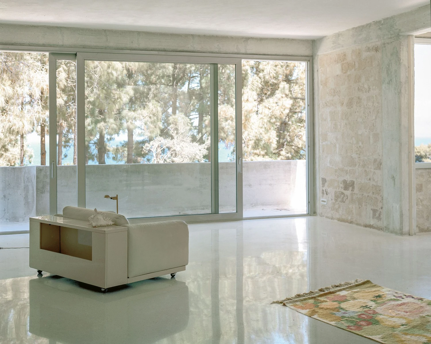 Guardia di Finanza by Brandlhuber+ — Interior view of the renovated Guardia di Finanza station revealing a minimalist bathroom suite.