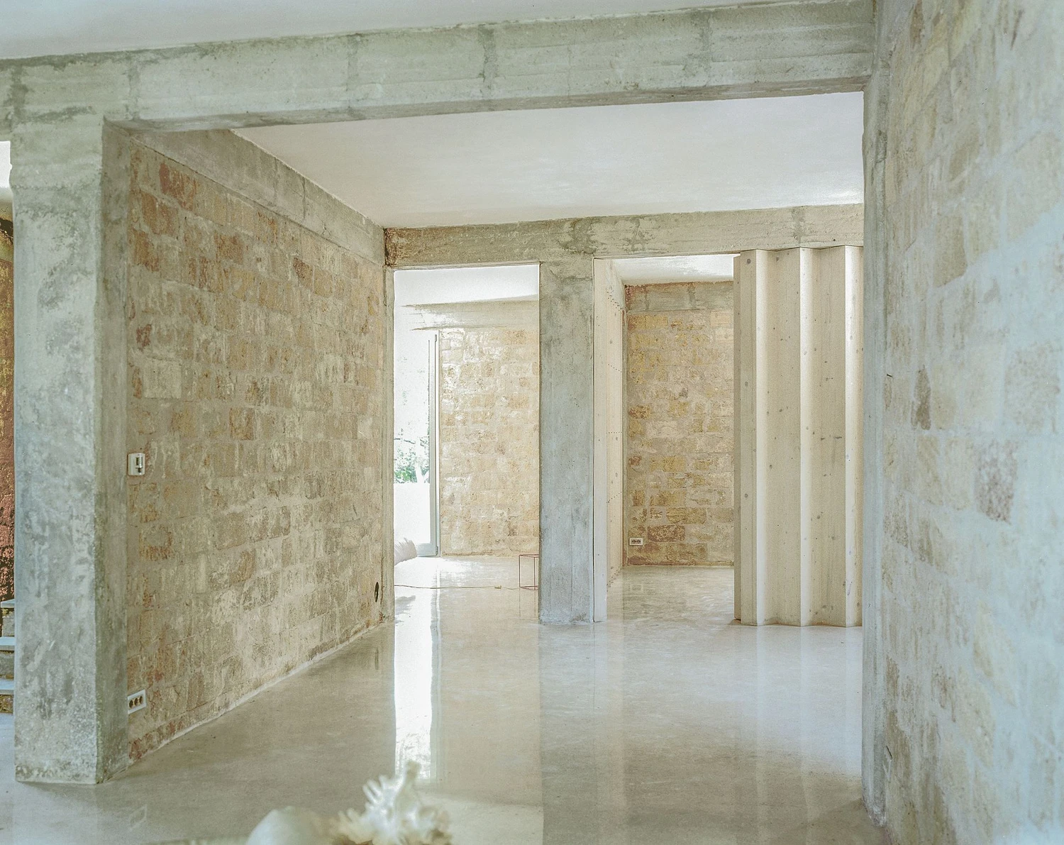 Guardia di Finanza by Brandlhuber+ — An interior passage through the renovated Guardia di Finanza station reveals the structural logic of Brandlhuber+'s intervention.