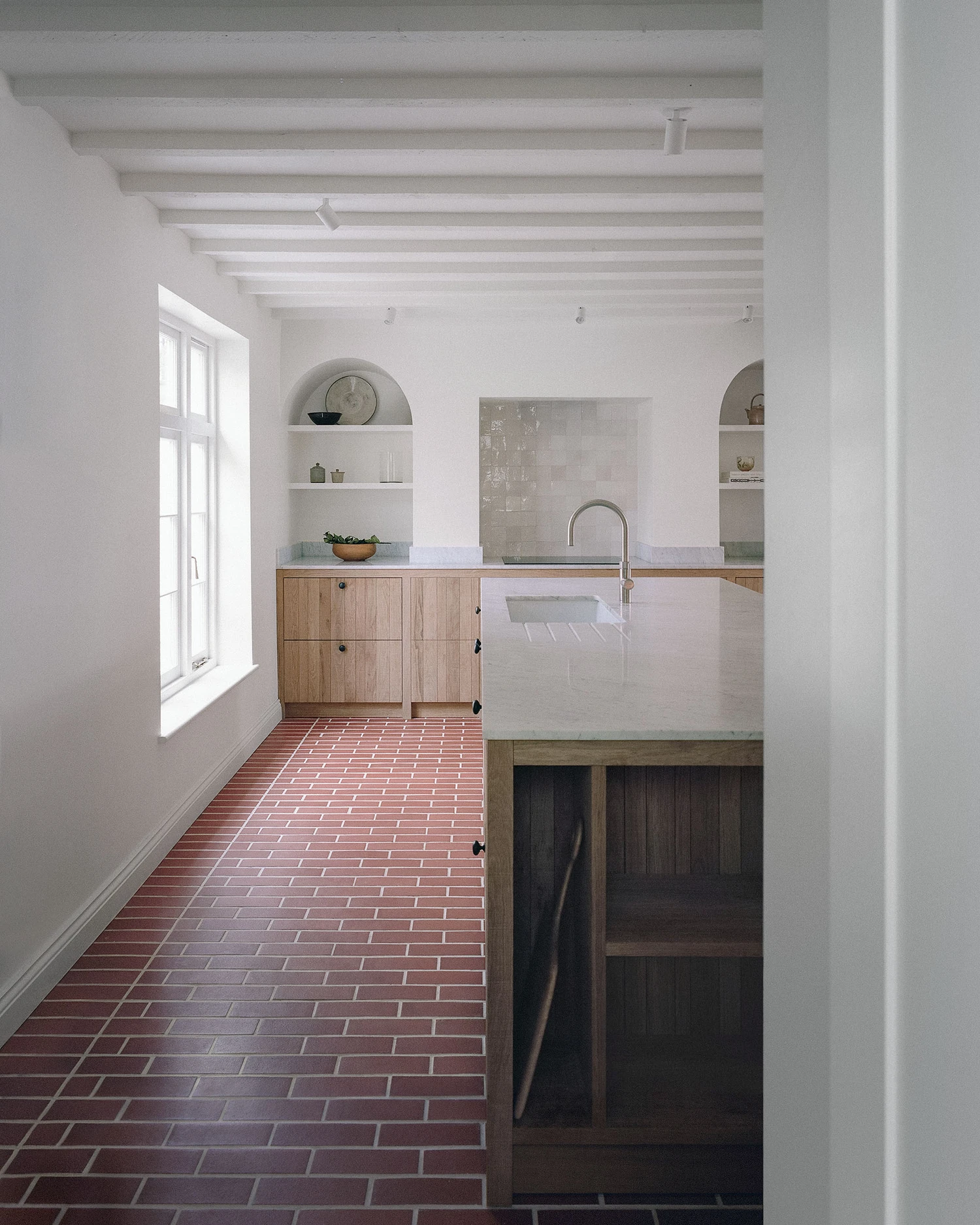 Barnsbury House by Architecture for London — A galley kitchen in Barnsbury House demonstrates restrained intervention within a listed Georgian townhouse.