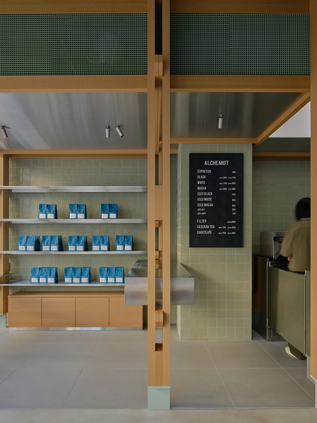 Alchemist Aoyama by Wynk Collaborative — The ground floor retail display establishes a commercial pavilion defined by structural rhythm.