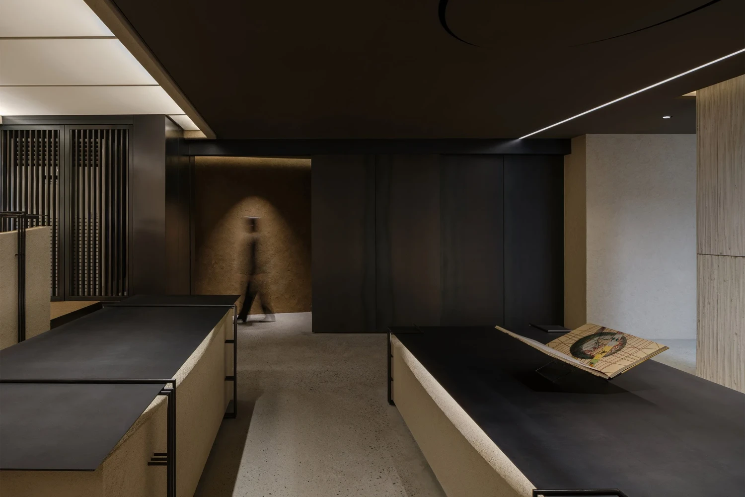 The Graphic bookstore by OONN Metaworks + U.LAB — Interior passage of The Graphic bookstore reveals a deliberately constrained spatial sequence.
