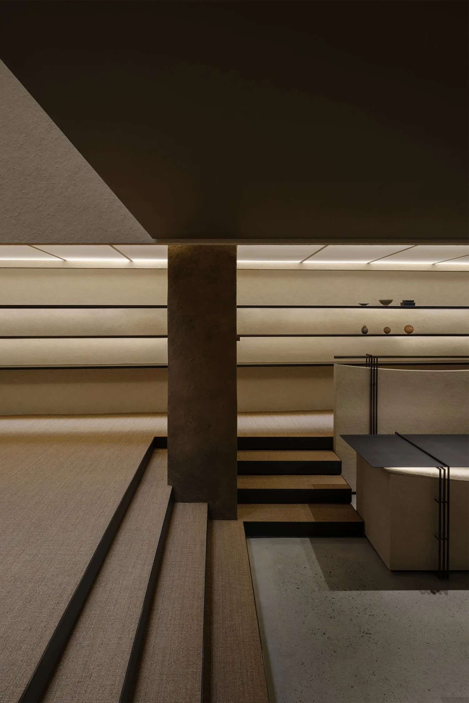 The Graphic bookstore by OONN Metaworks + U.LAB — A view down the stairwell reveals the structural hierarchy of the Graphic bookstore's interior.