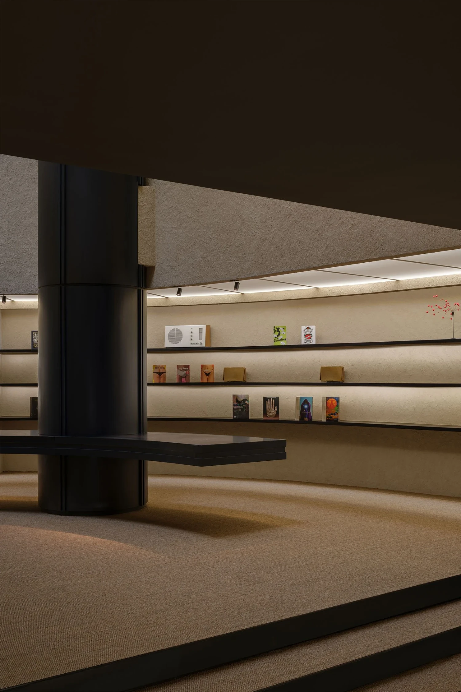 The Graphic bookstore by OONN Metaworks + U.LAB — The Graphic bookstore interior reveals a precisely orchestrated retail display system.