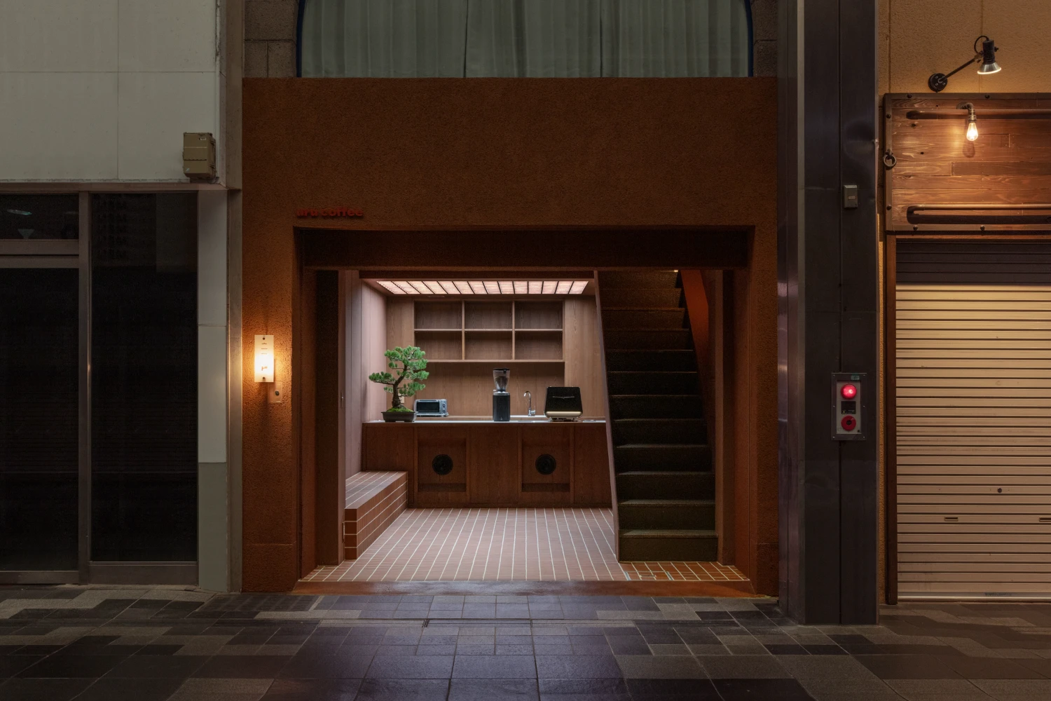 uru coffee by TRANSFORM — A narrow storefront interior defined by restraint and material honesty.