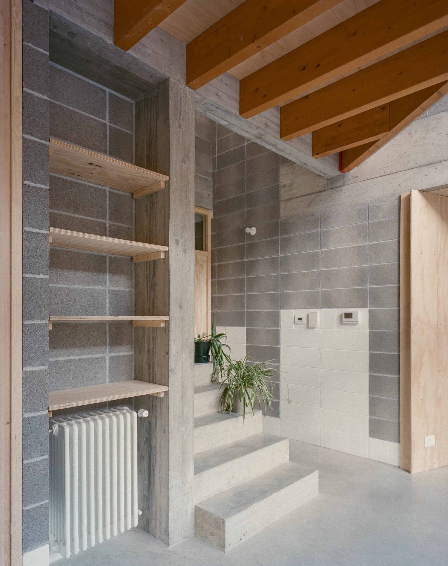 Casa BM by ErranteArchitetture — A bathroom interior under construction reveals the Casa BM's structural strategy.
