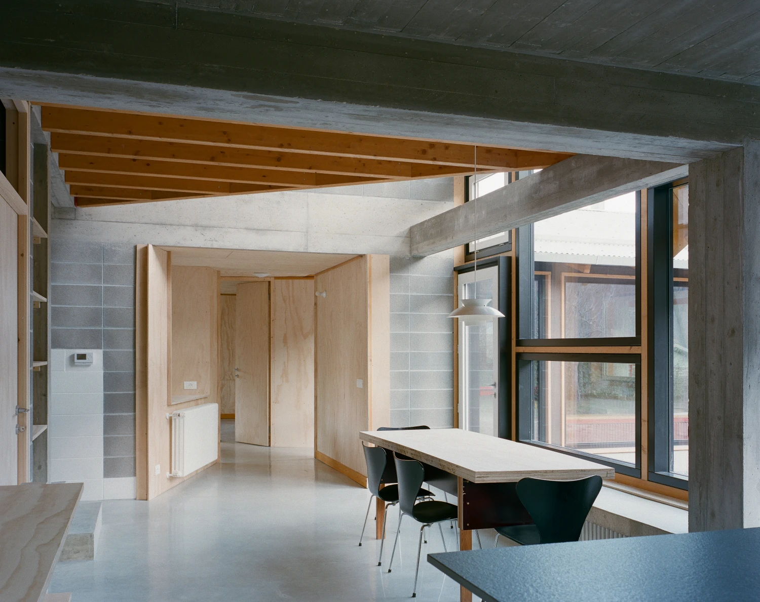 Casa BM by ErranteArchitetture — Interior view of Casa BM revealing the spatial strategy of insertion and extension.