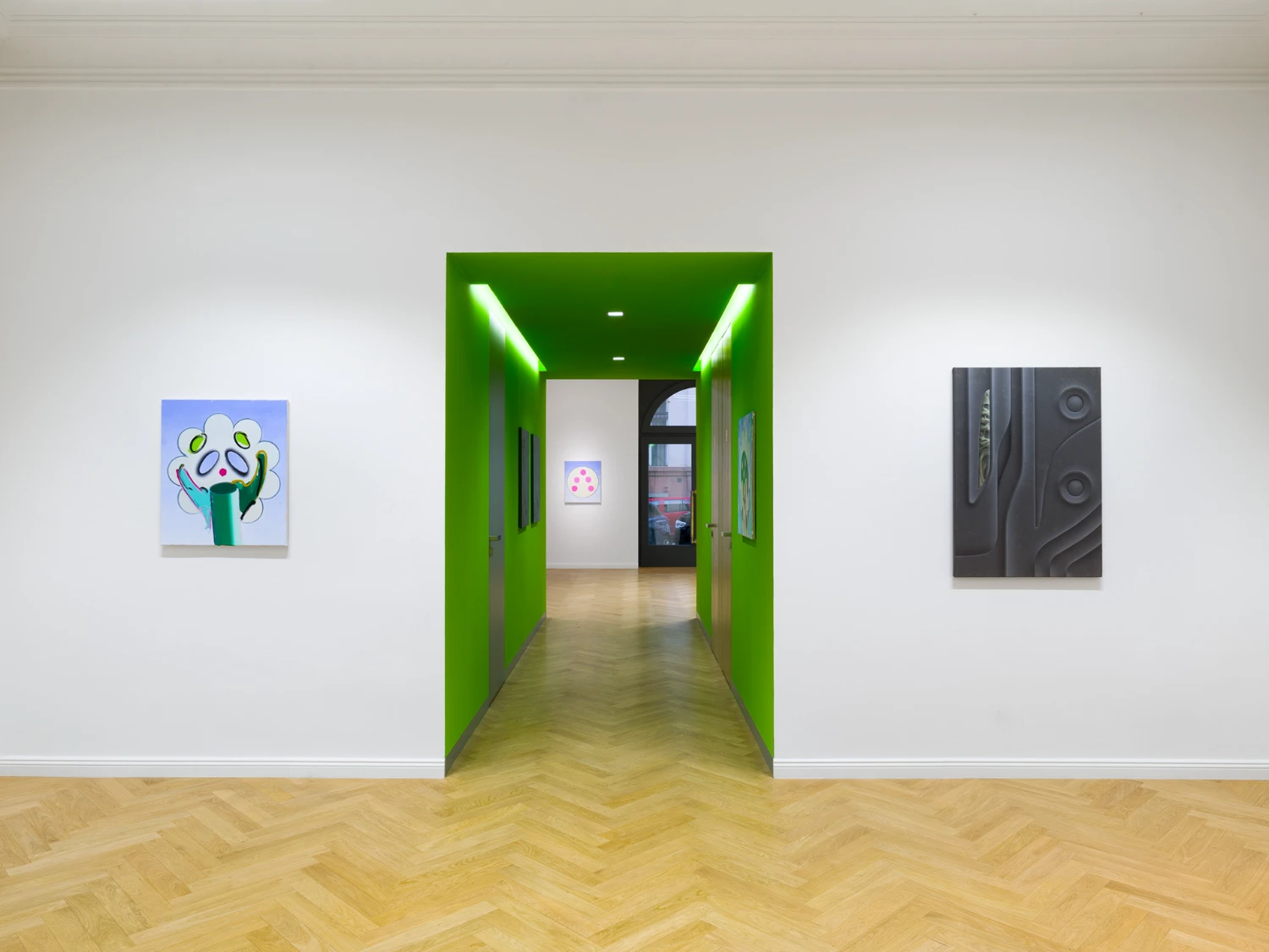 Bloom by Tomáš Absolon Milan Vagač at SPOT Gallery — A bright lime-green portal frames the gallery threshold, its neon-lit edges creating sharp geometric contrast against white walls.