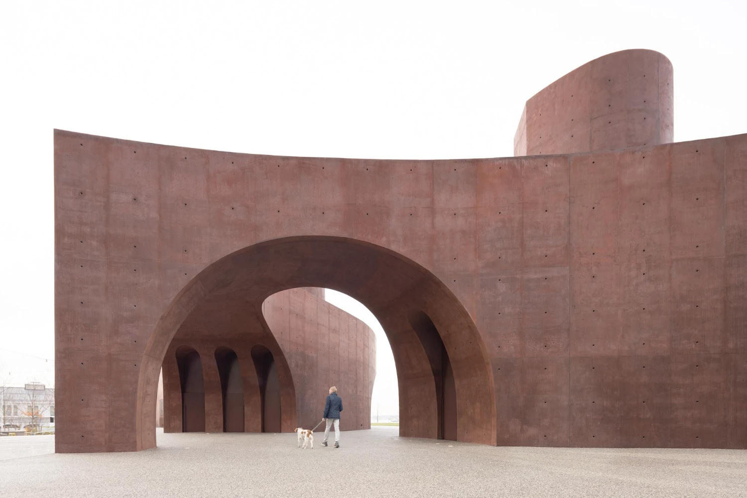 Wagner Park Pavilion by Thomas Phifer — Wagner Park Pavilion presents a monumental concrete gateway defined by twin curved archways that frame a deep passage.
