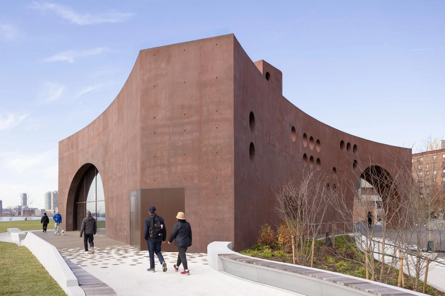 Wagner Park Pavilion by Thomas Phifer — The Wagner Park Pavilion presents a monumental concrete gateway defined by twin curved archways that frame a central void.