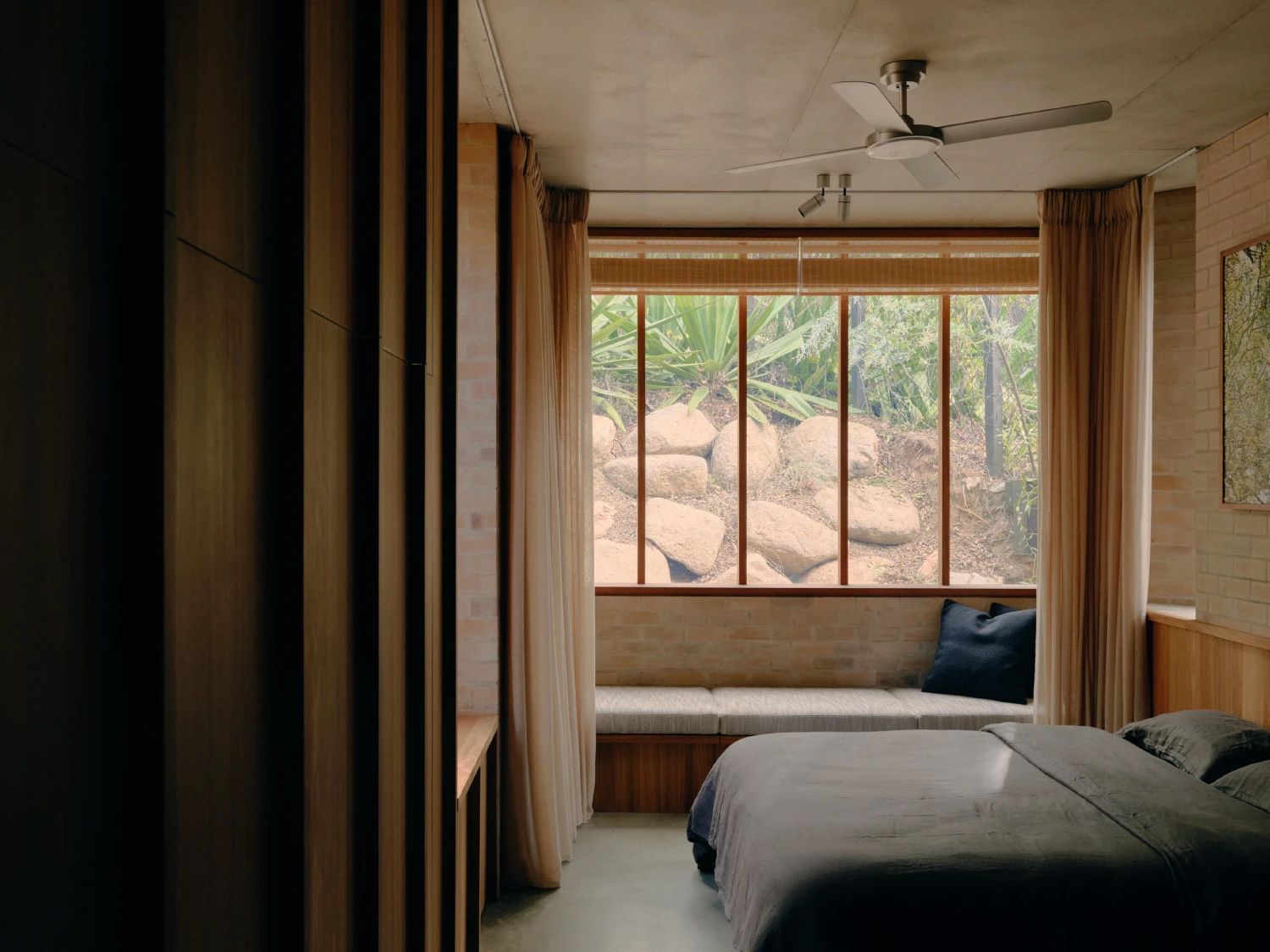 Stuartholme House by Nielsen Jenkins + Michael Lumby — A bedroom interior demonstrates restrained spatial composition through minimal furnishing and material clarity.