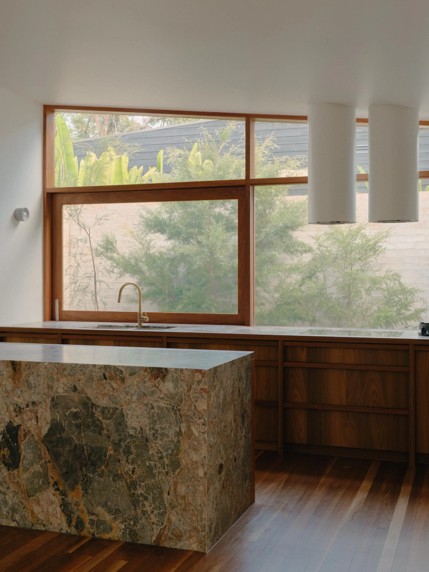 Stuartholme House by Nielsen Jenkins + Michael Lumby — The kitchen anchors itself to the landscape through materiality and restraint.