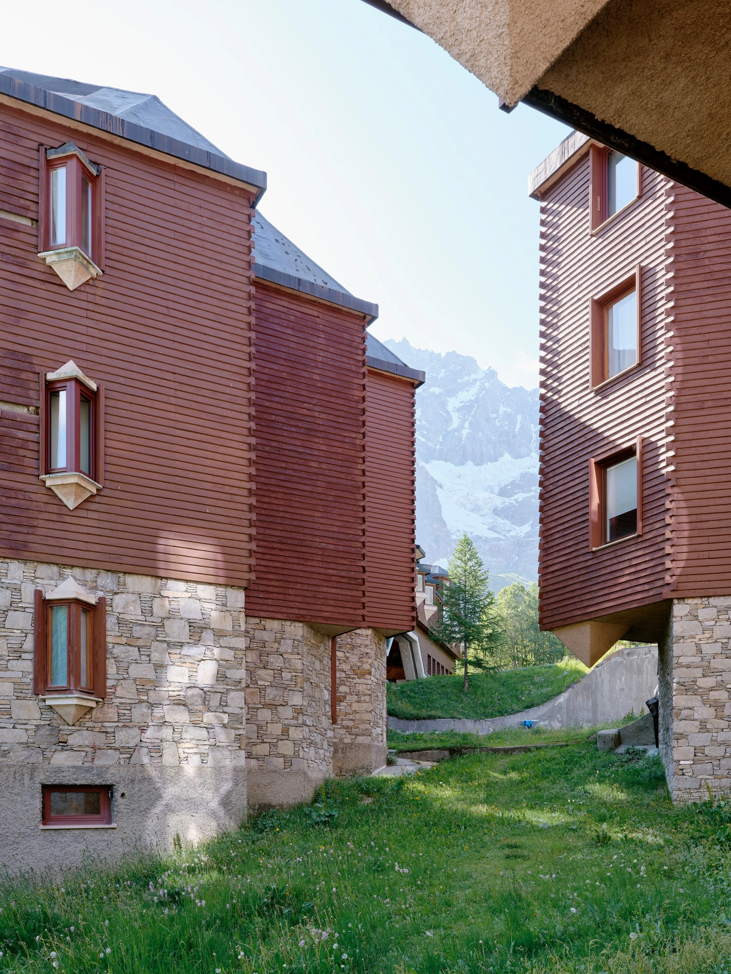 An Interior at Giomein by co.arch — The exterior courtyard passage reveals the project's structural exposure strategy.