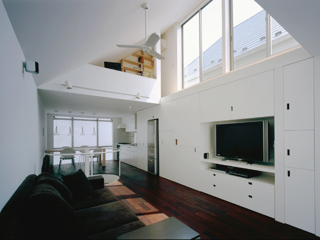 Long Tall House by Spacespace — Interior view of Long Tall House revealing the vertical stacking strategy across multiple storeys.