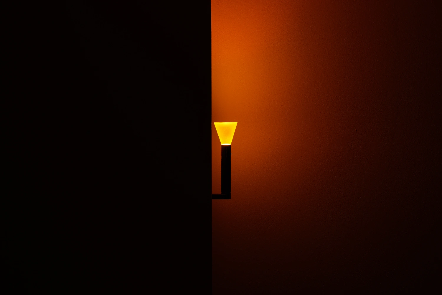 Halo Mag (Flame + Bloom) designed by Mandalaki — Mandalaki's Halo Flame edition presents a minimal sculptural intervention suspended against a warm orange gradient wall.