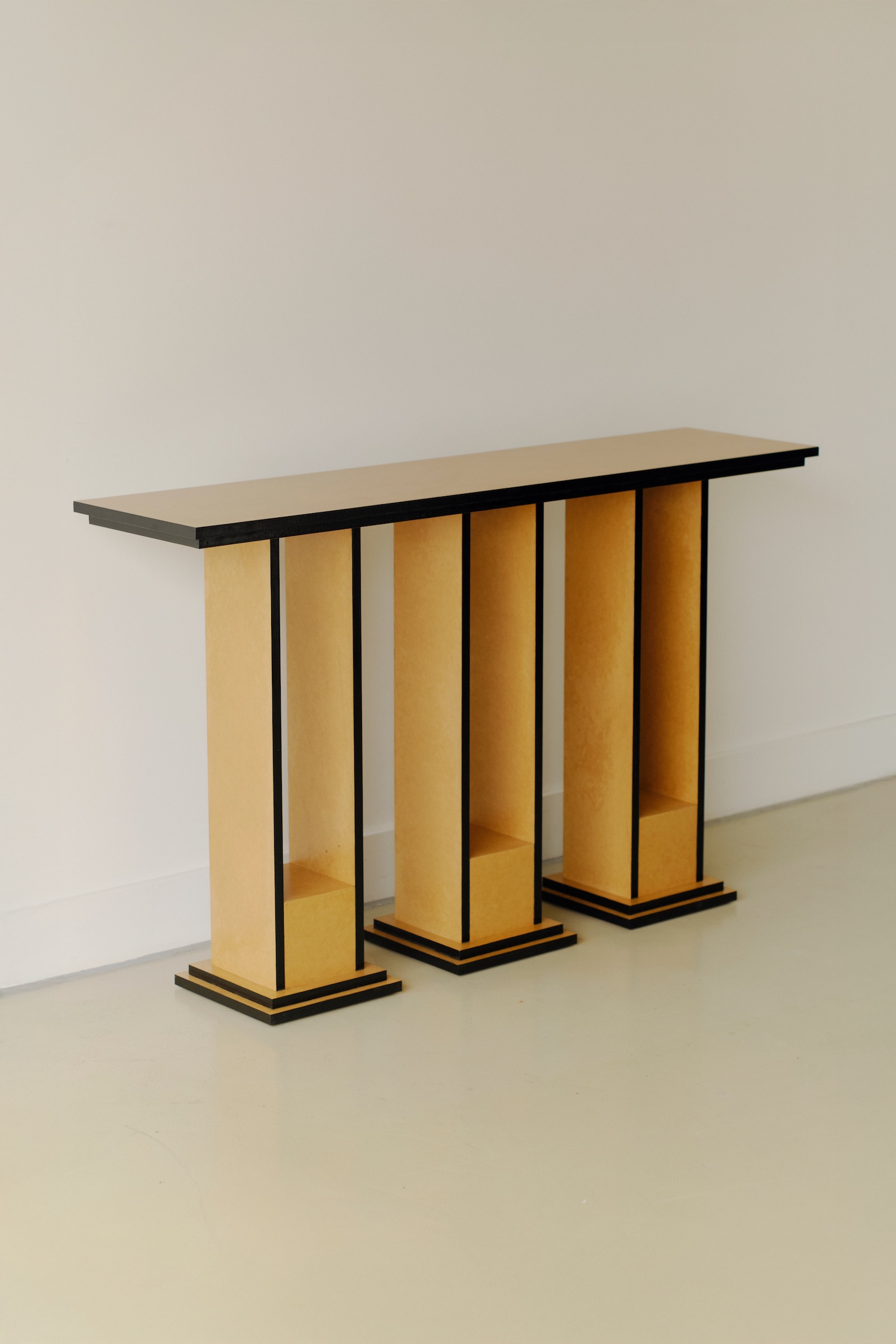 Undressed Collection by Georgina Davies — A console table from the Undressed Collection featuring two vertical MDF support structures with exposed edges and visible seams.