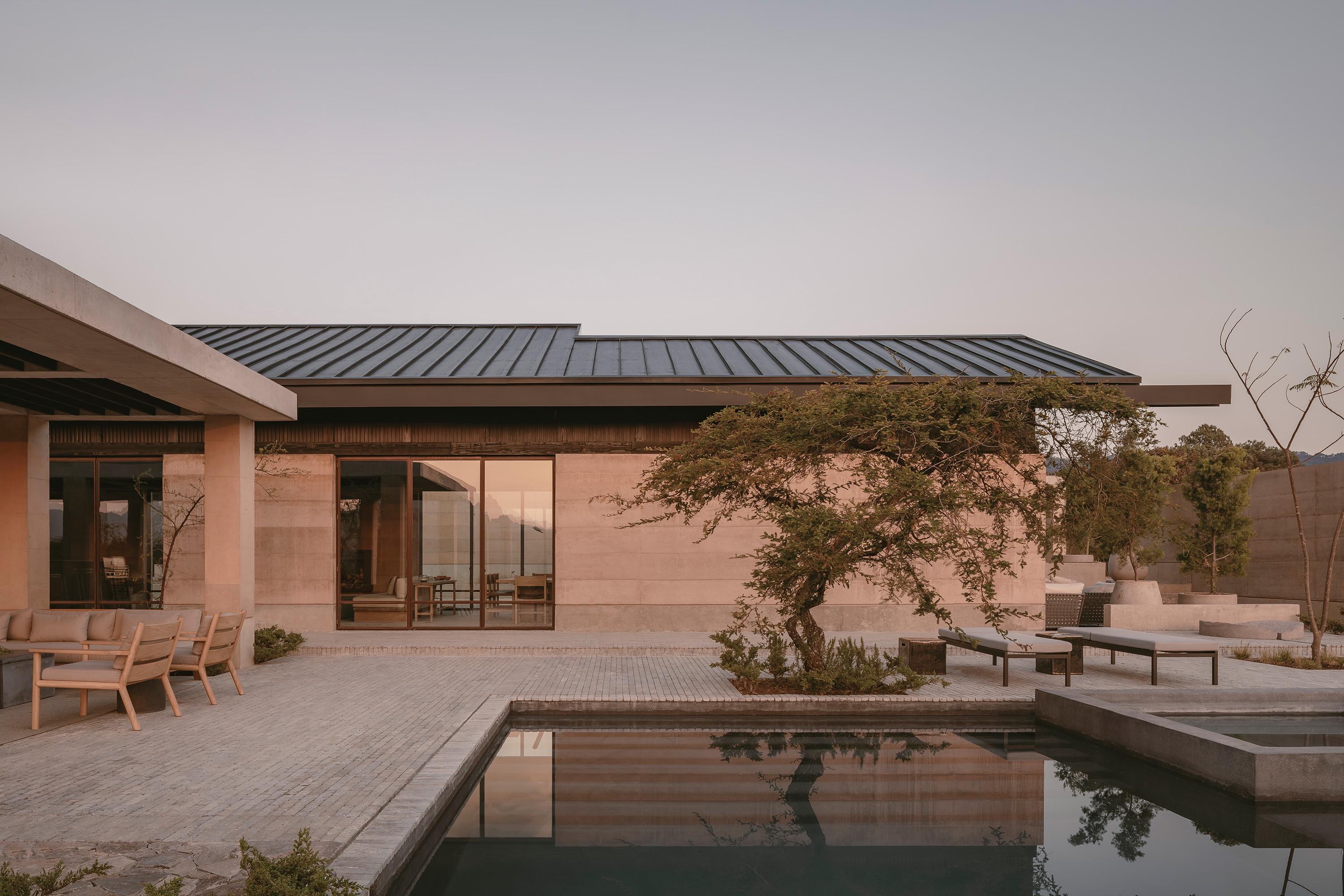 Casa el Espino by Soler Orozco Arquitectos — Casa el Espino presents itself as a single-story terracotta brick structure anchored to Valle de Bravo's topography.