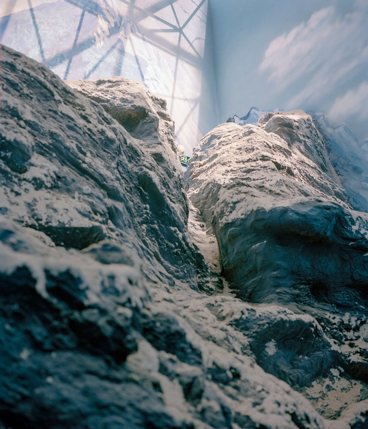 The Internal Crusade by Zexuan Zeng — A narrow gorge between two massive sandstone formations towers above the photographer's vantage point.
