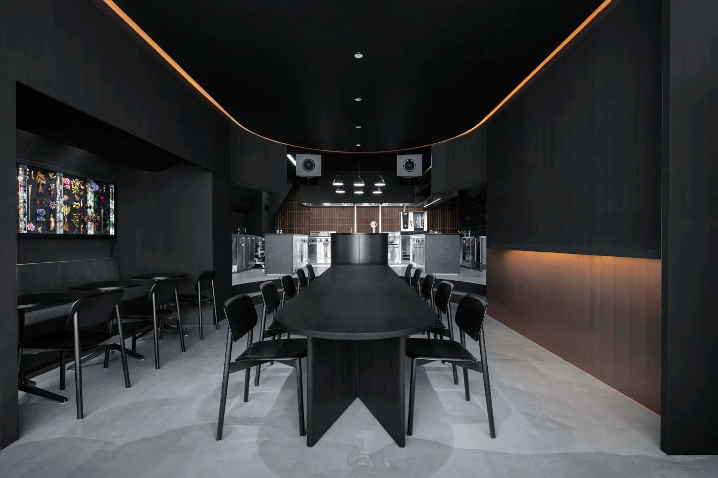 Burnside by Snøhetta — The dining zone captured from a centered, low vantage point emphasizes the geometric symmetry of Burnside's dual-purpose interior.