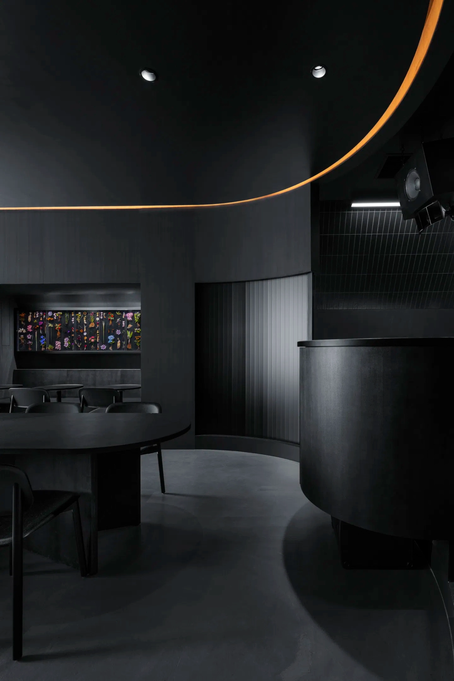 Burnside by Snøhetta — The dining zone demonstrates the project's material restraint through layered monochromatic surfaces.