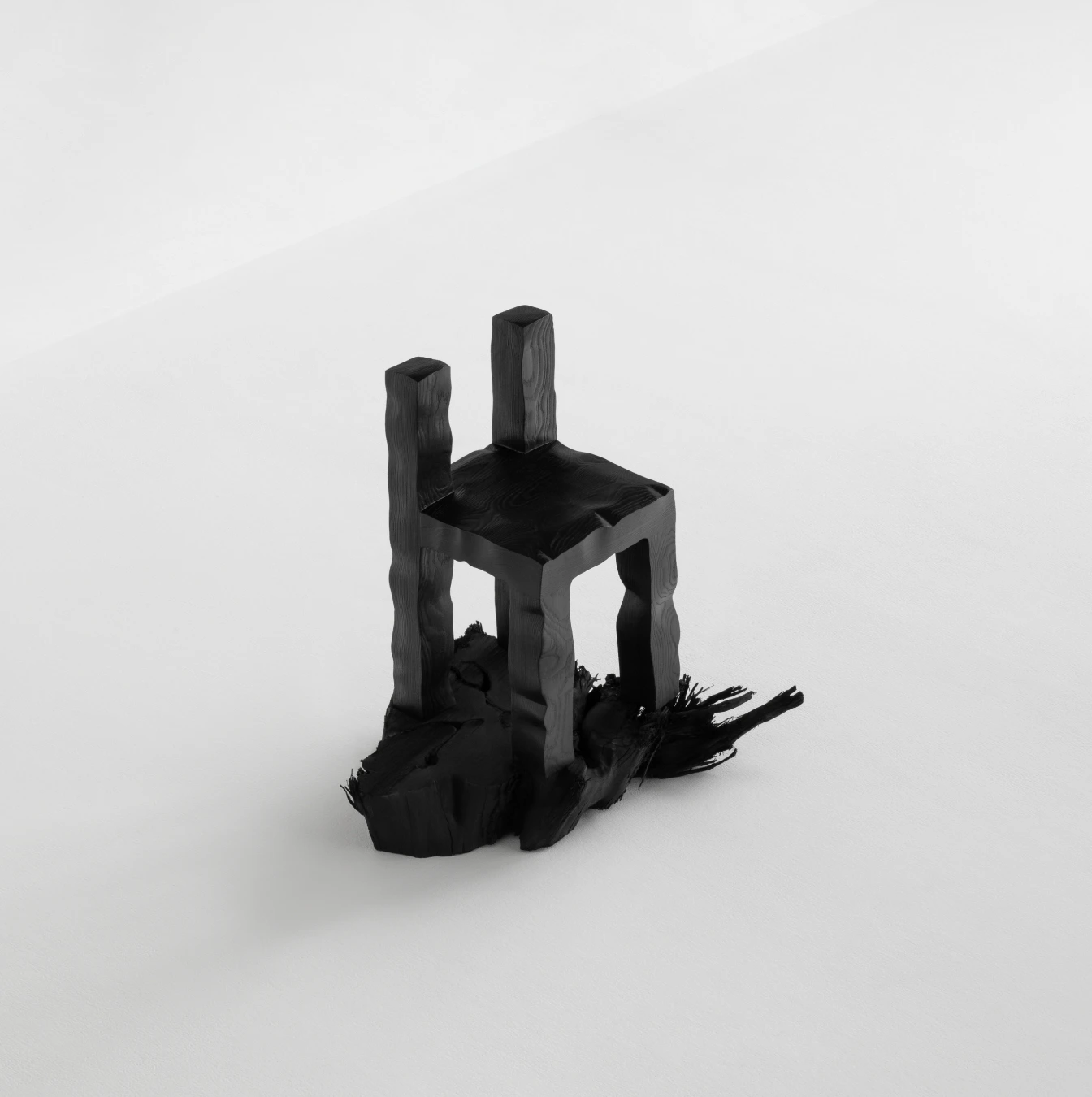 KAMEH 0.5 Collection by KAMEH — A charred timber chair from the KAMEH 0.5 collection rendered in high-contrast monochrome.