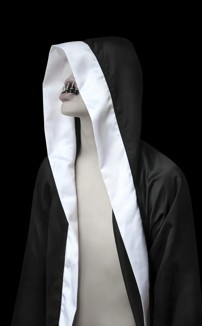 TRANSHUMANISM by Joanna Grochowska at Untitled Space Gallery — A mannequin figure draped in contrasting monochromatic textiles explores bodily abstraction through material concealment.
