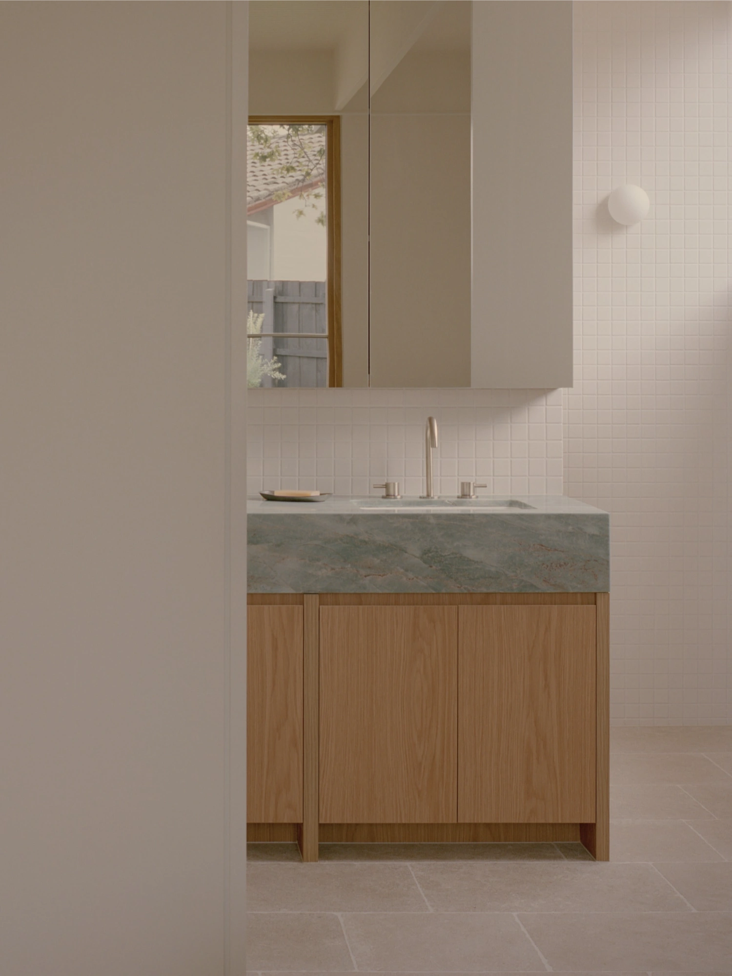 Mount Martha House by Victoria Merrett Architects — A bathroom vanity articulates the material hierarchy established throughout Mount Martha House.