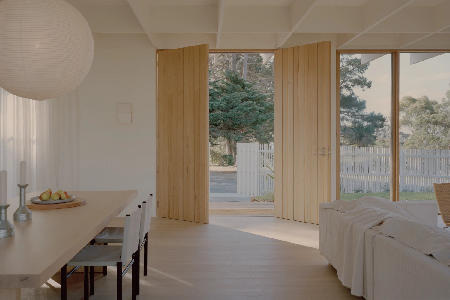Mount Martha House by Victoria Merrett Architects — A monolithic interior volume defined by continuous glazed wall systems and timber-framed mullions that dissolve the threshold between dwelling and landscape.
