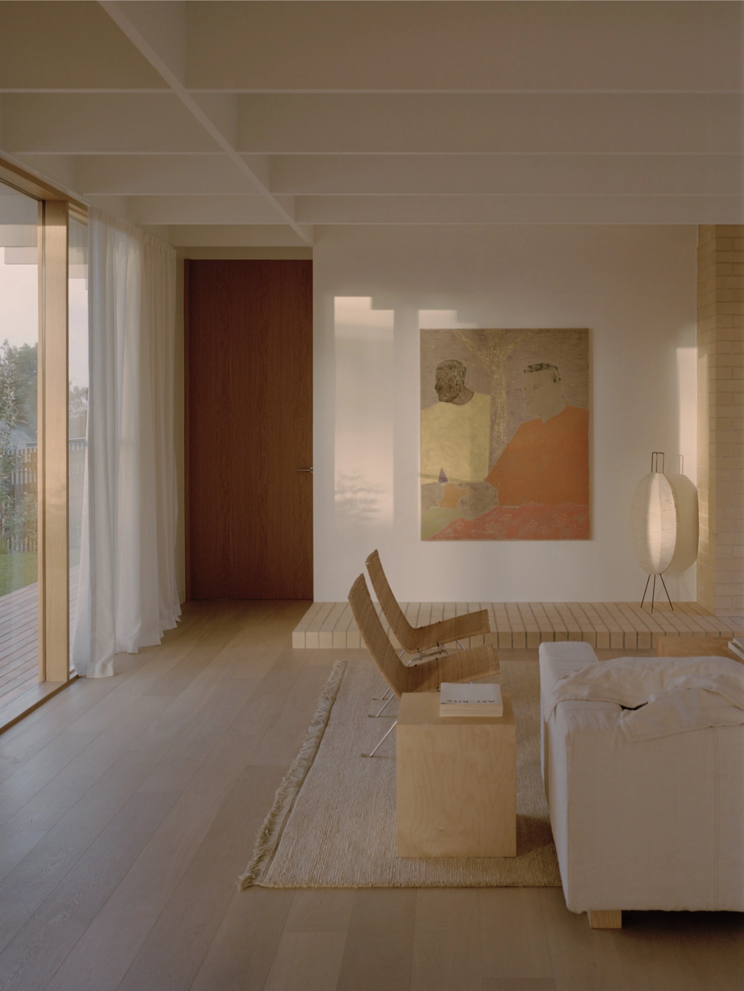 Mount Martha House by Victoria Merrett Architects — A bedroom volume defined by timber decking that extends from interior to exterior threshold, establishing visual continuity with the landscape beyond.