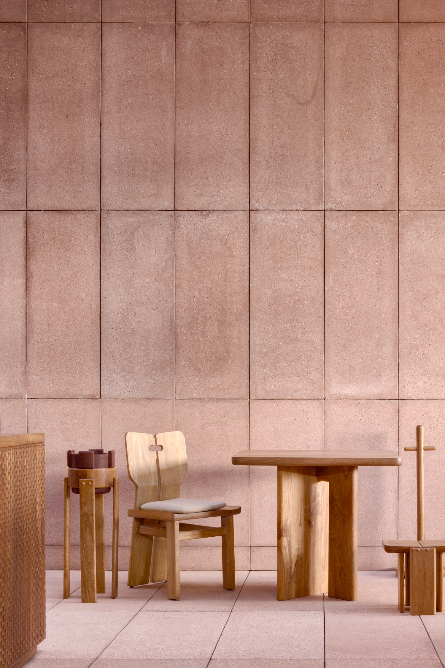 Rubra Restaurant by Ignacio Urquiza + Ana Paula de Alba — Interior detail of Rubra Restaurant showcasing the mauve-pink ceramic tile wall system in uniform grid pattern, with vertical grout lines creating strong...