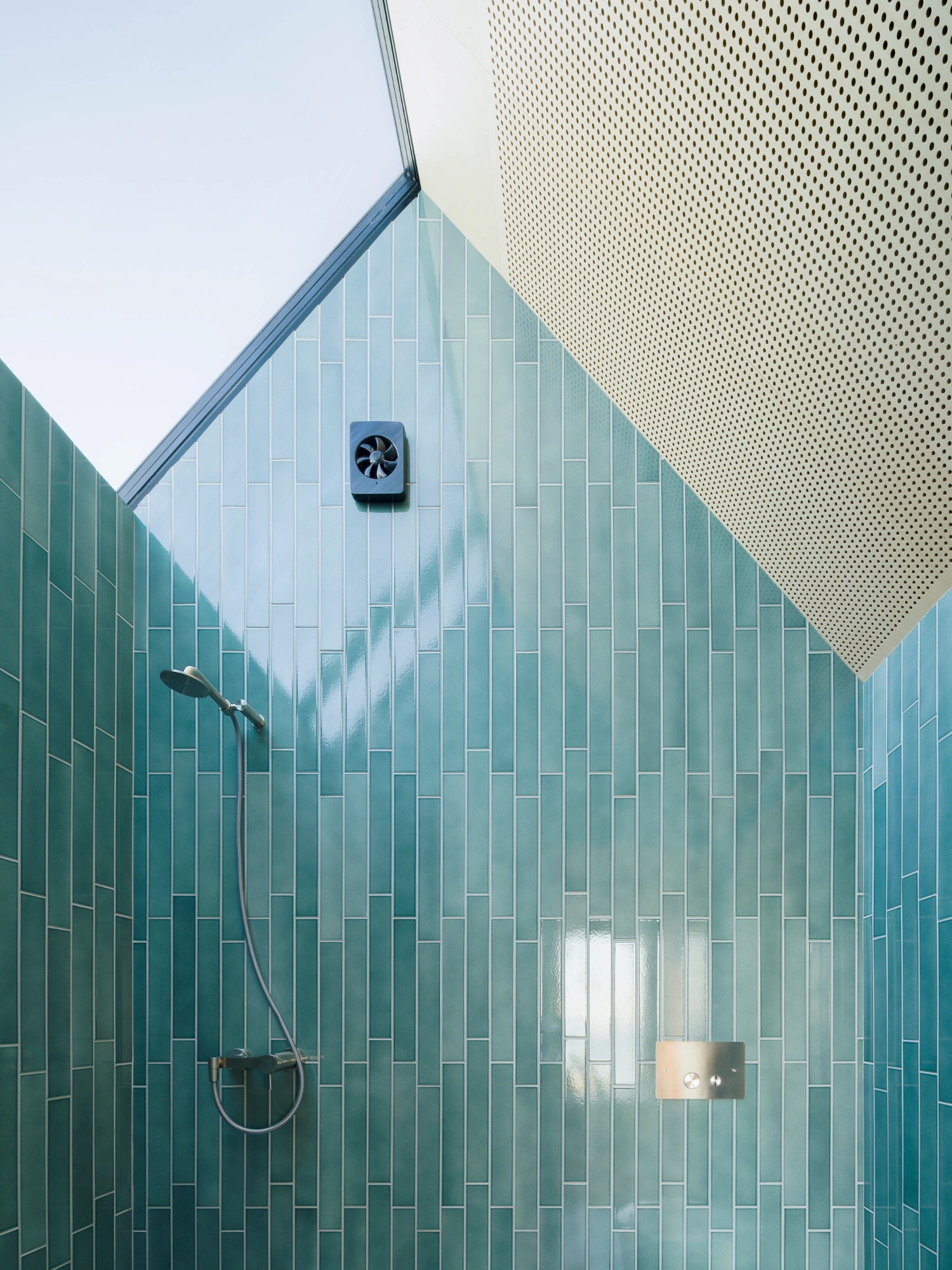 Strandvejen 35 Summer House by Jesper Kusk Arkitekter — A close-up view of the summer house's bathroom, captured from directly above the shower enclosure.