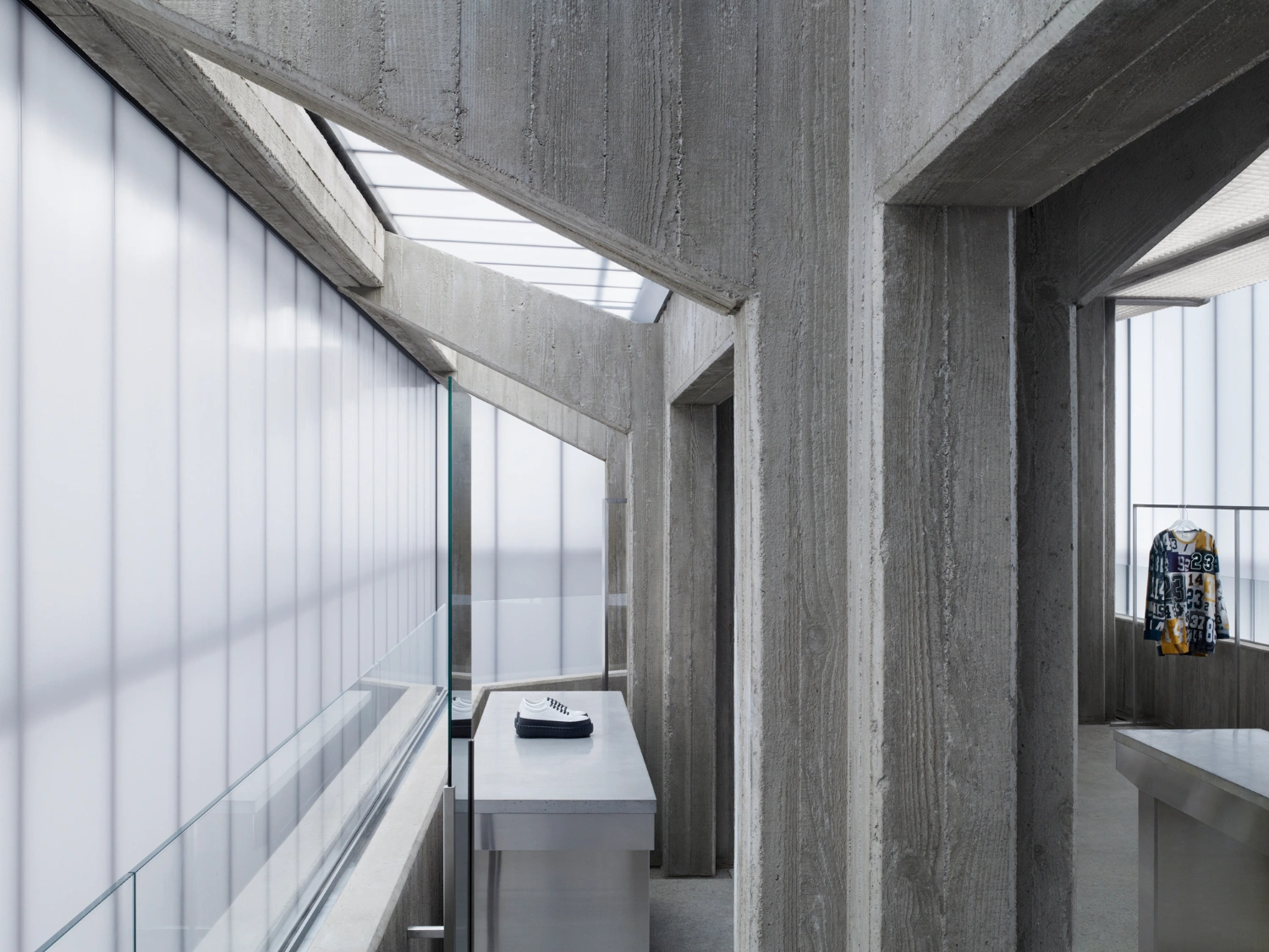 Acne Studios Cheongdam by Sophie Hicks Architects — The interior passage reveals the architectural strategy through layered concrete construction.