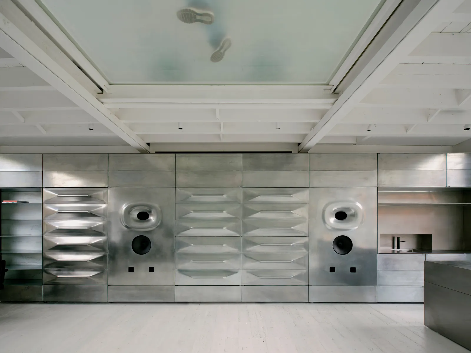Salt Salon by unknown works — A bathroom interior clad entirely in large-format ceramic tiles arranged horizontally, the grout lines creating a pronounced striped pattern across the wall.