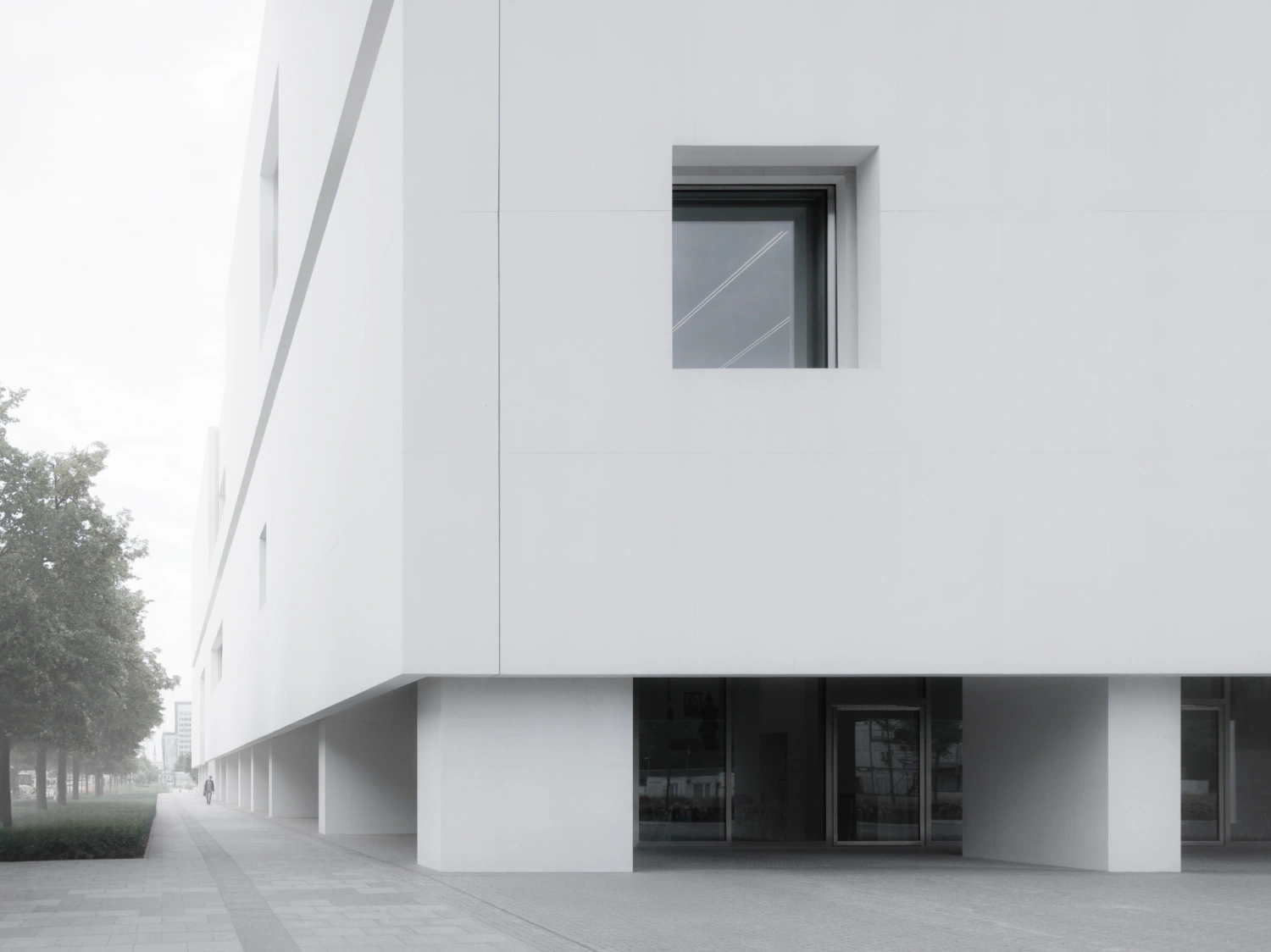 Museum of Modern Art in Warsaw by Thomas Phifer — The ground-level entrance of the Museum of Modern Art reveals the crisp white concrete construction that defines Thomas Phifer's design.