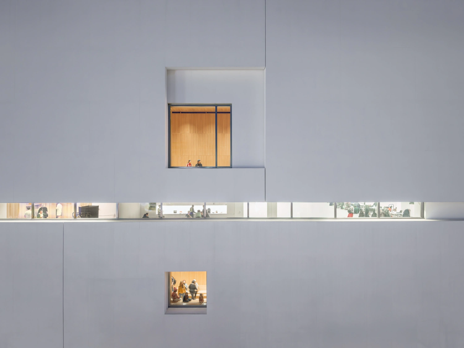 Museum of Modern Art in Warsaw by Thomas Phifer — The Museum of Modern Art's facade demonstrates a stacked composition of white concrete floor plates punctuated by recessed window openings.