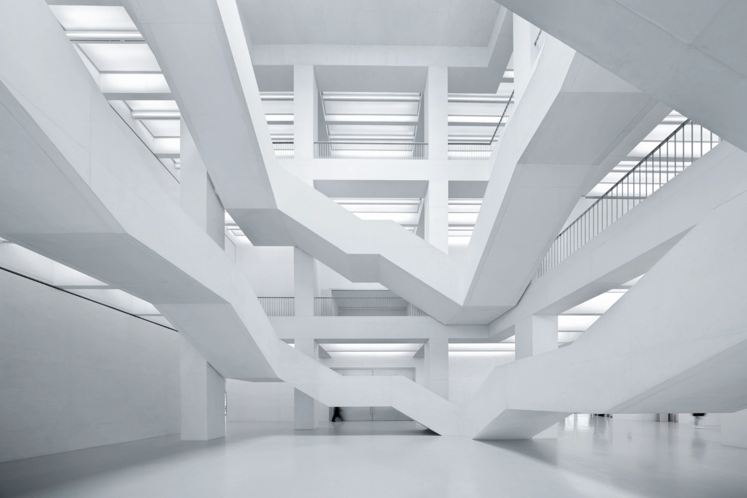 Museum of Modern Art in Warsaw by Thomas Phifer — The atrium of the Museum of Modern Art Warsaw reveals its structural logic through stacked concrete floor plates with recessed edges that cast pronounced...