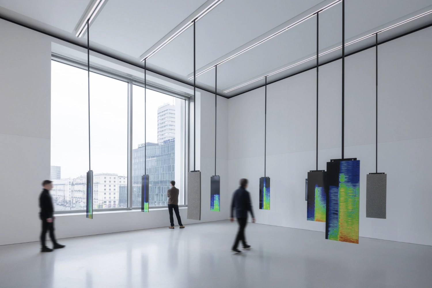 Museum of Modern Art in Warsaw by Thomas Phifer — The museum's interior gallery space demonstrates Phifer's geometric precision through suspended display screens arranged in spatial intervals.