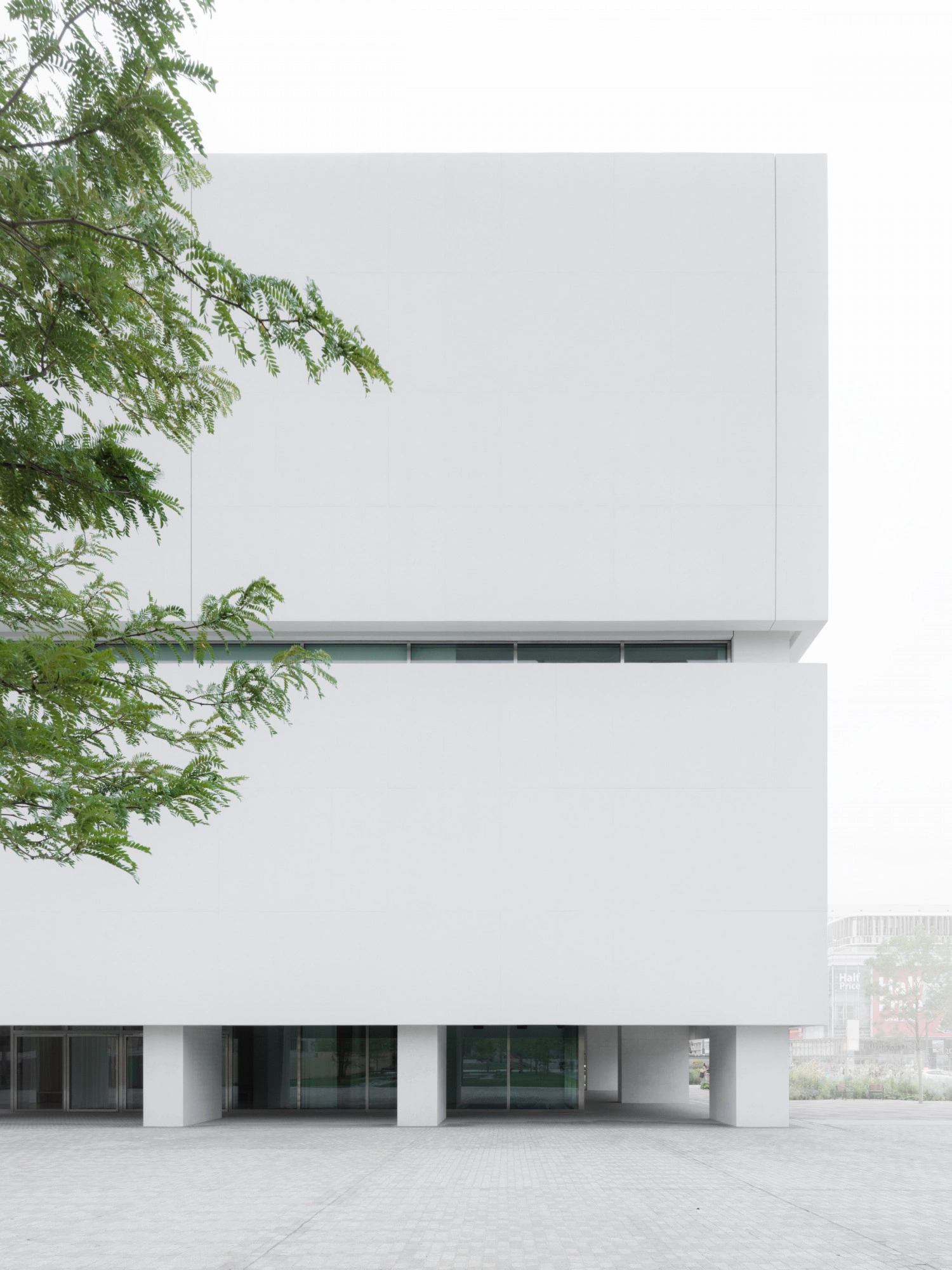 Museum of Modern Art in Warsaw by Thomas Phifer — The Museum of Modern Art's stacked concrete volumes rise in white monolithic form, punctuated by a horizontal slot window that runs across the facade's...