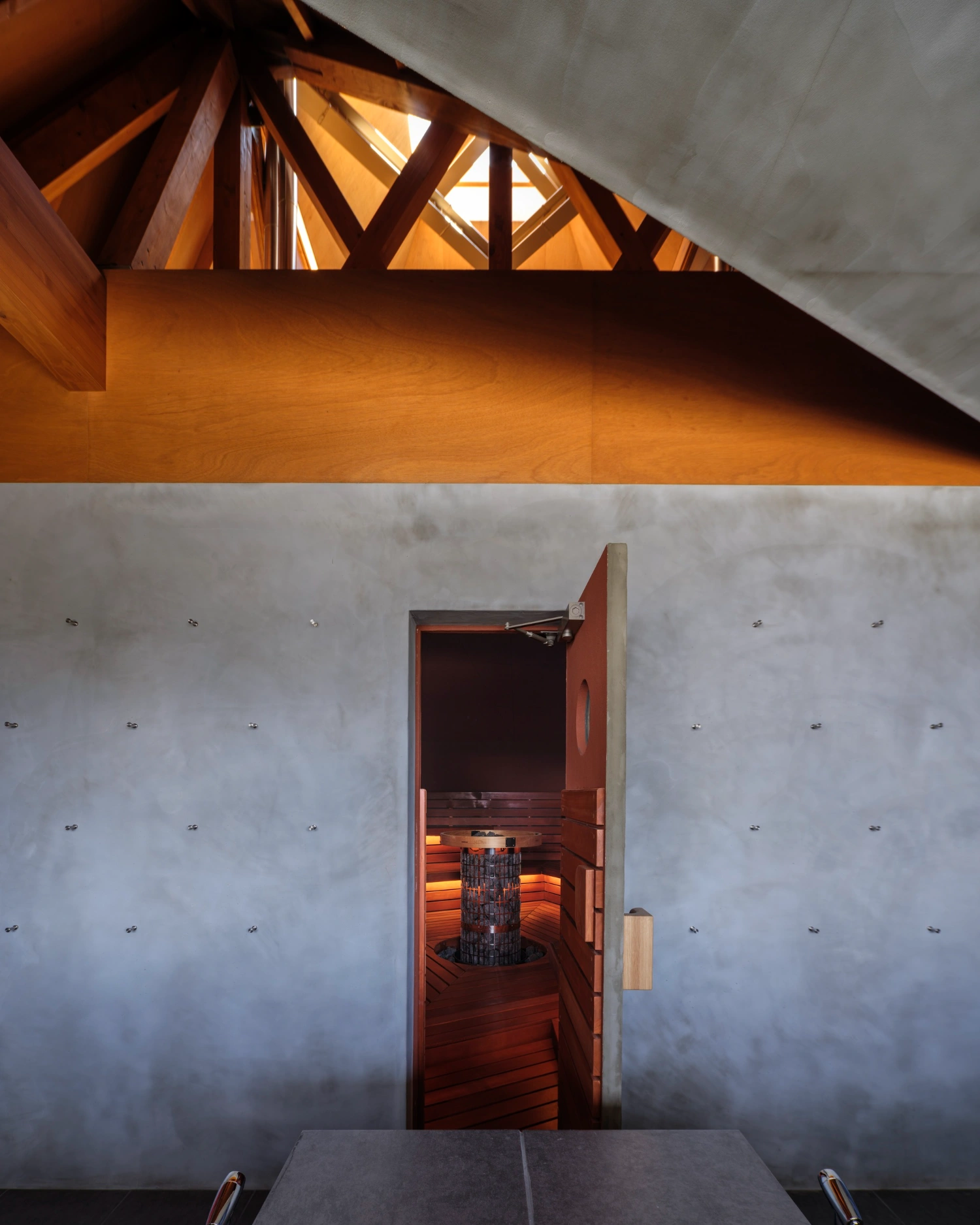 CYCL by YŪ Momoeda Architects — The sauna's interior threshold frames a controlled view toward the wooden chamber beyond.