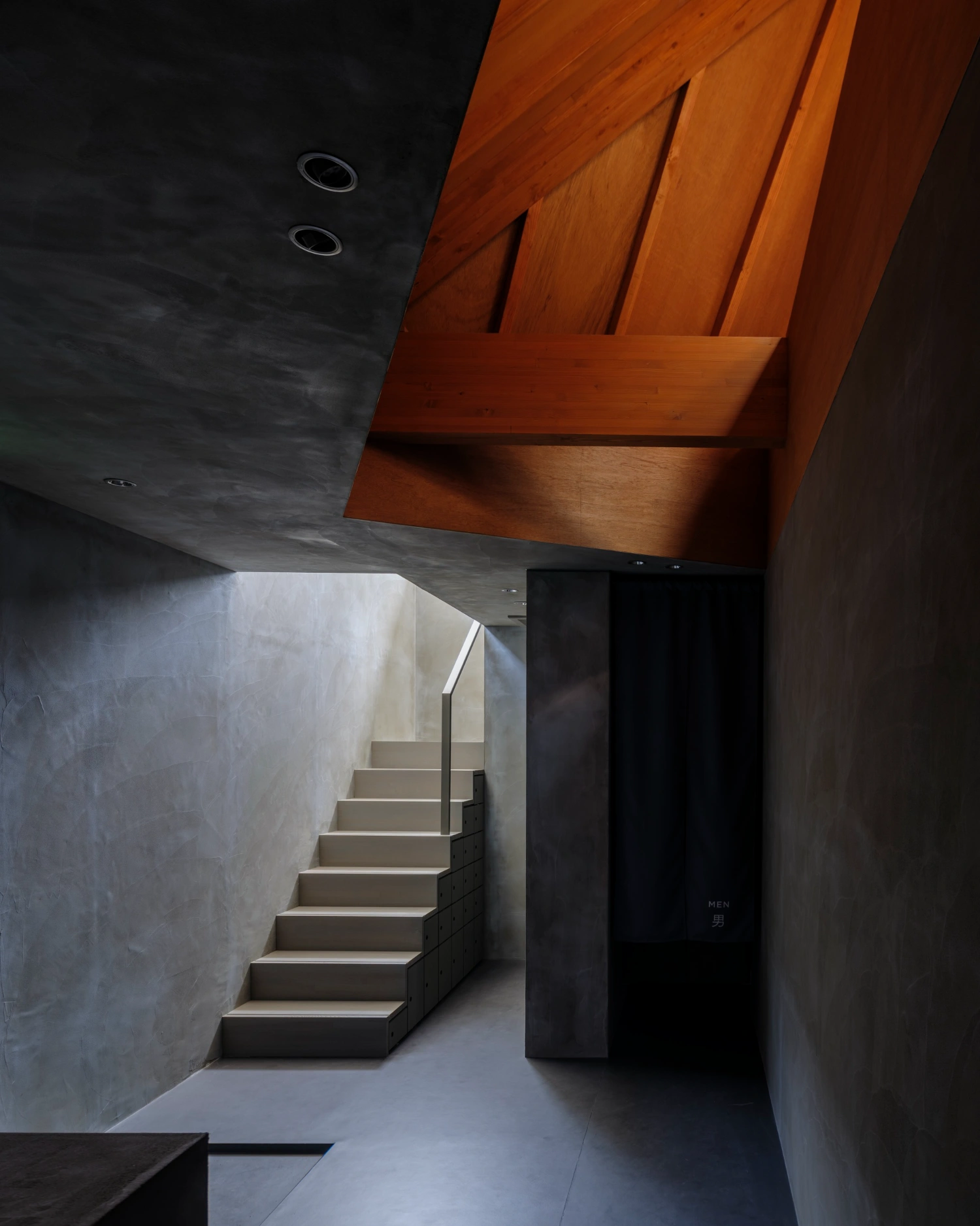 CYCL by YŪ Momoeda Architects — A monolithic concrete staircase ascends through a narrow passage, its treads precisely aligned in receding perspective.
