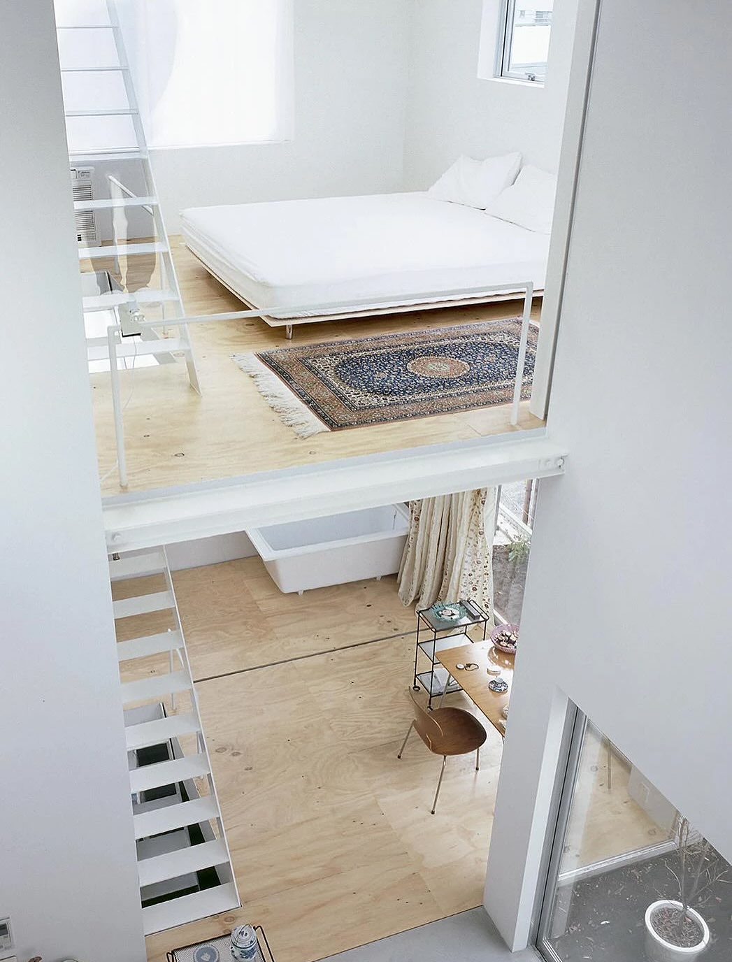 House A by Ryue Nishizawa — A vertical sectional view through House A reveals the stacked spatial organization of Nishizawa's design.