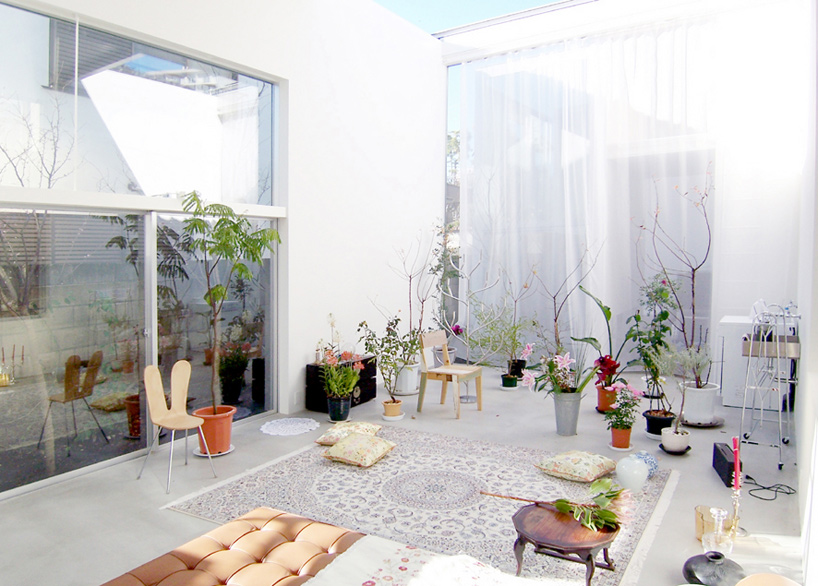 House A by Ryue Nishizawa — A sun-flooded interior chamber demonstrates Nishizawa's strategy of fragmented volumes connected through glazed thresholds.