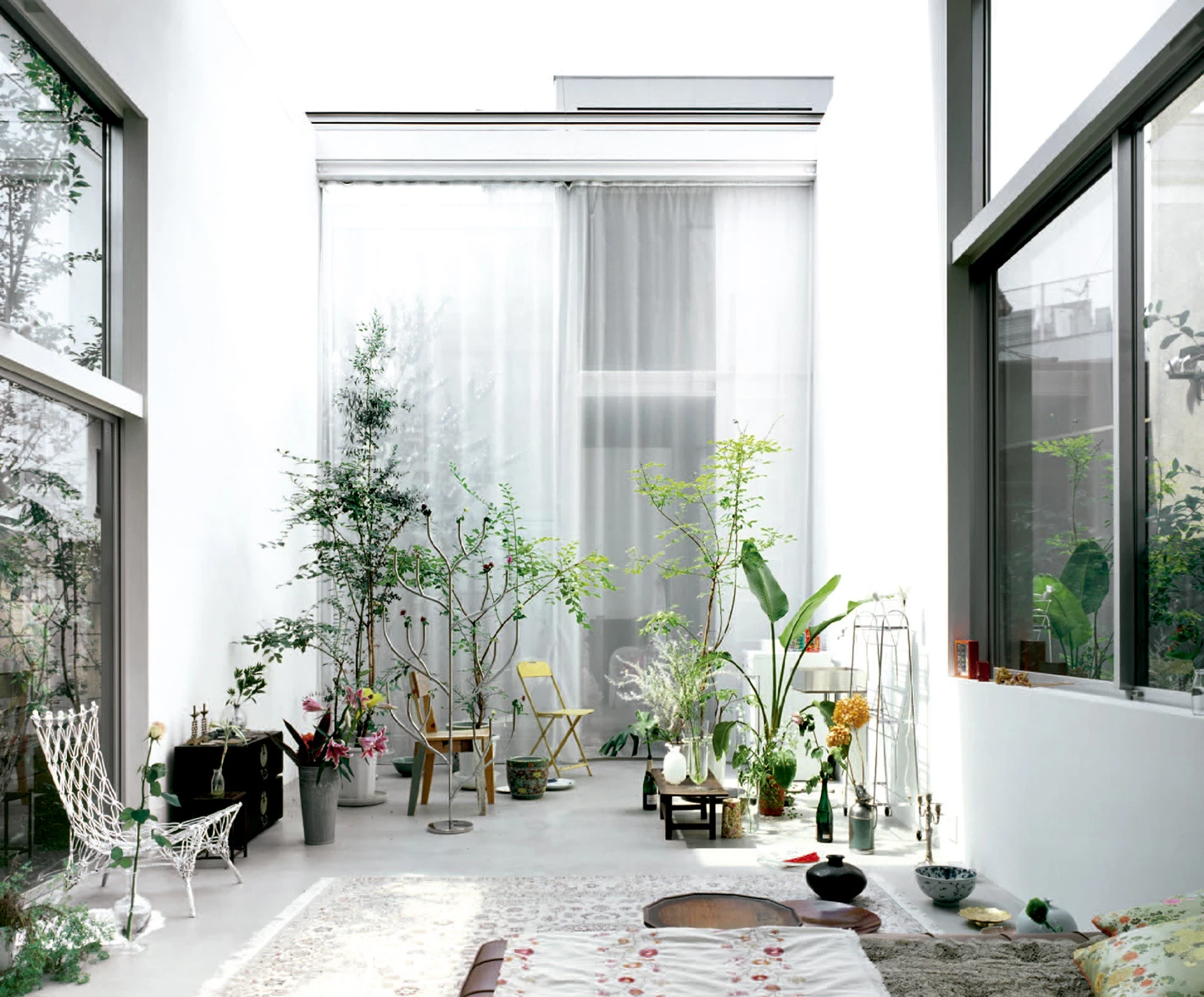 House A by Ryue Nishizawa — A sectional view through House A reveals the architect's strategy of offsetting cubic volumes to create interconnected living spaces.