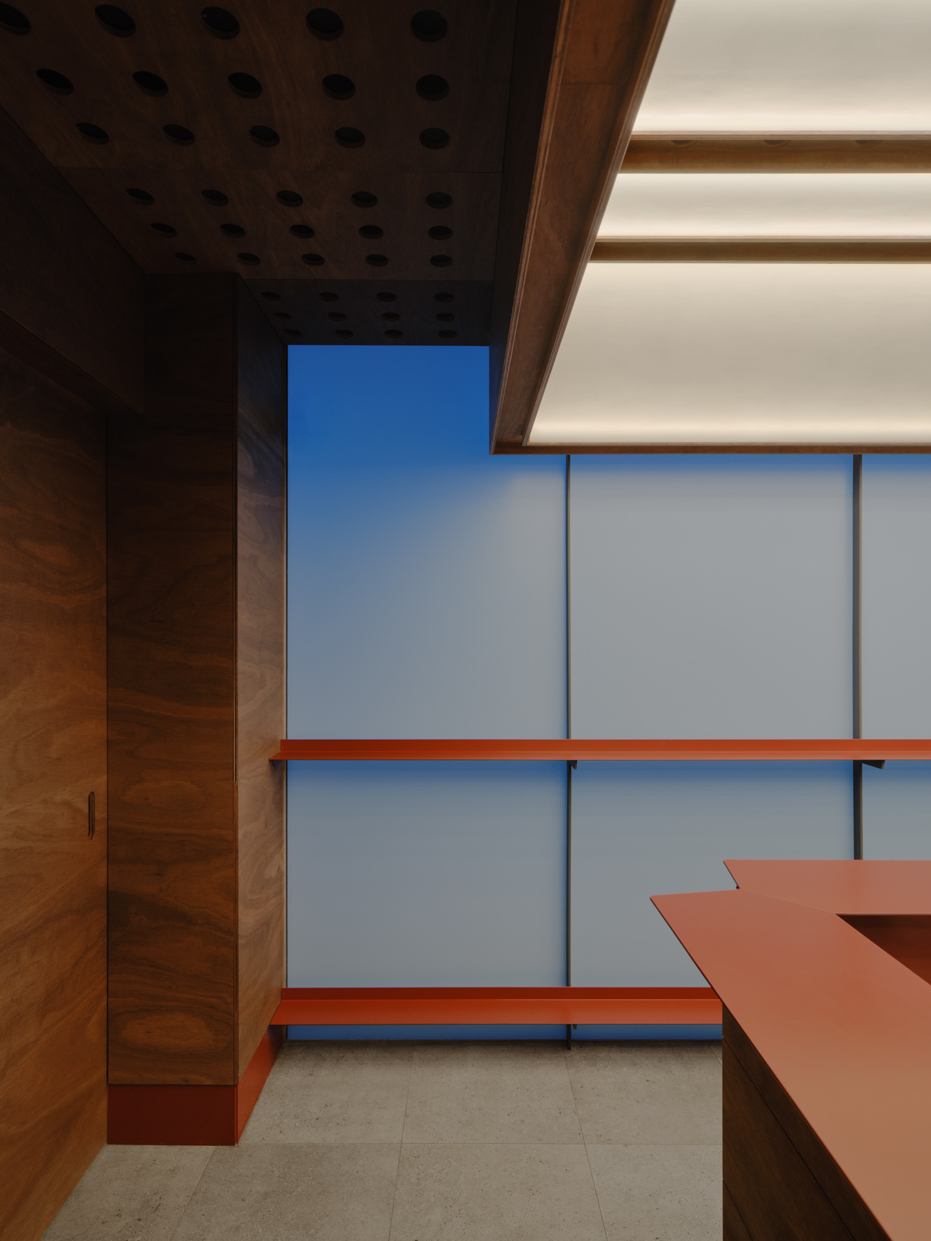 Palace Coffee by KKAP — Interior passage framed through expansive glazing reveals a layered spatial composition.