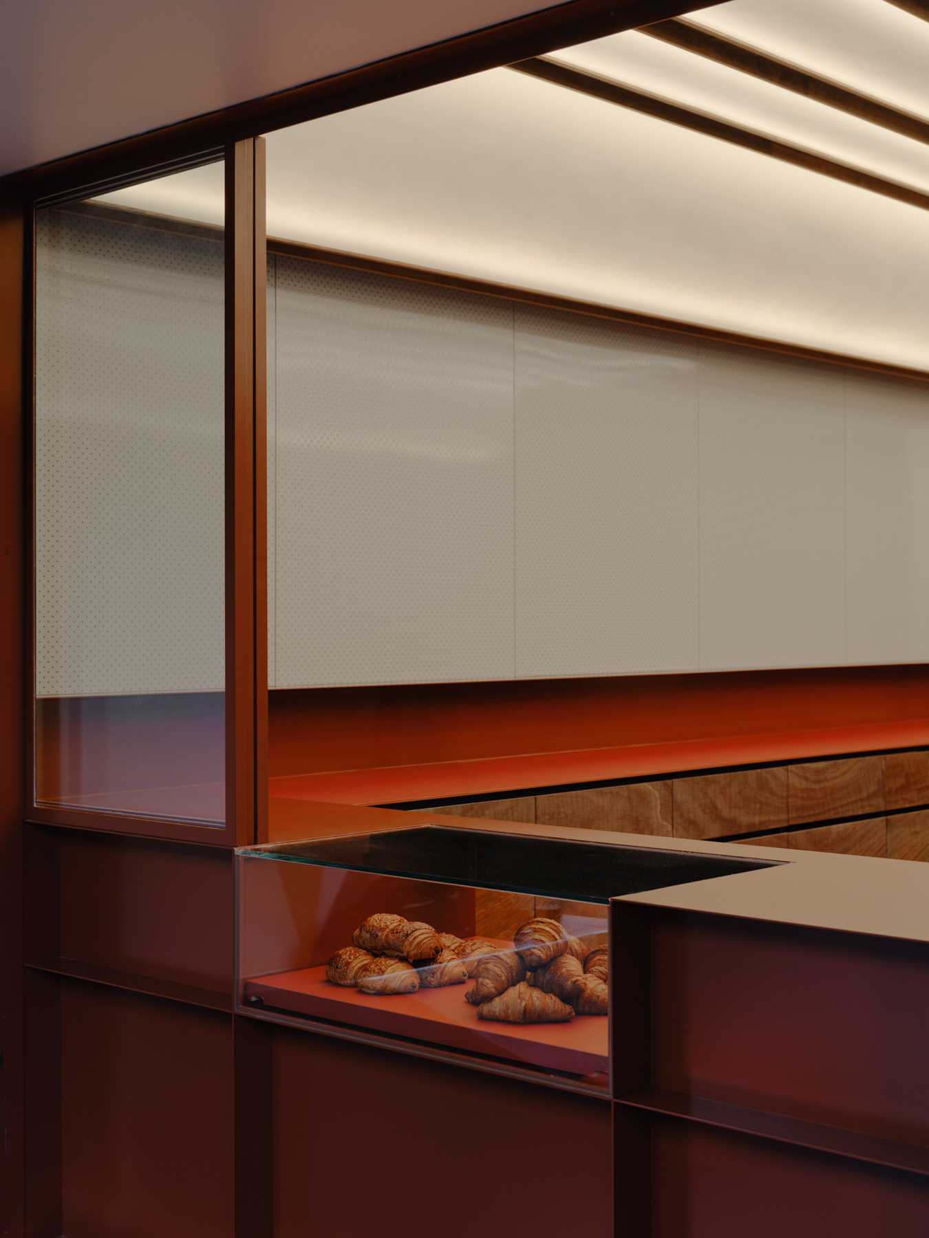 Palace Coffee by KKAP — The display window articulates the material hierarchy of Palace Coffee's interior through a stratified composition.