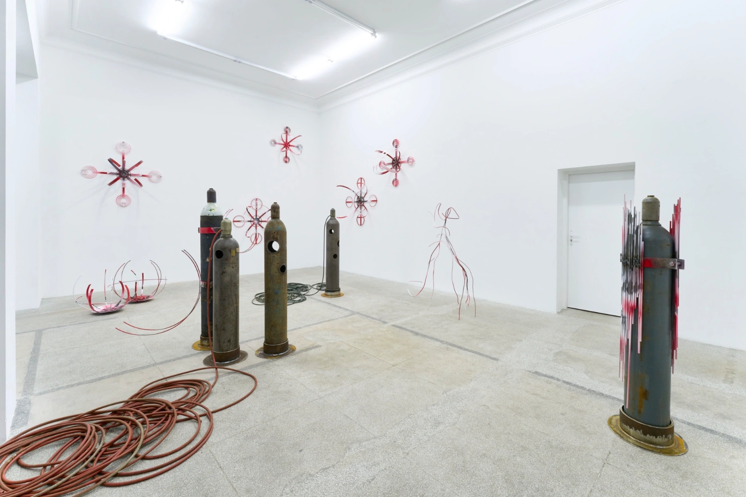 Swarm / Rój by Zuza Golinska at Piktogram — Golinska's installation occupies the gallery as a dispersed field of industrial and wire-based forms.